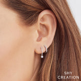 0.14CT 14K Y/G DIAMOND BEZEL HUGGIE EARRING