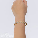 1.70CT 14K Y/G DIAMOND BAGUETTE BEZEL BANGLE