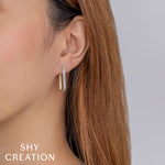 0.33CT 14K Y/G DIAMOND PAVE OVAL HOOP EARRING