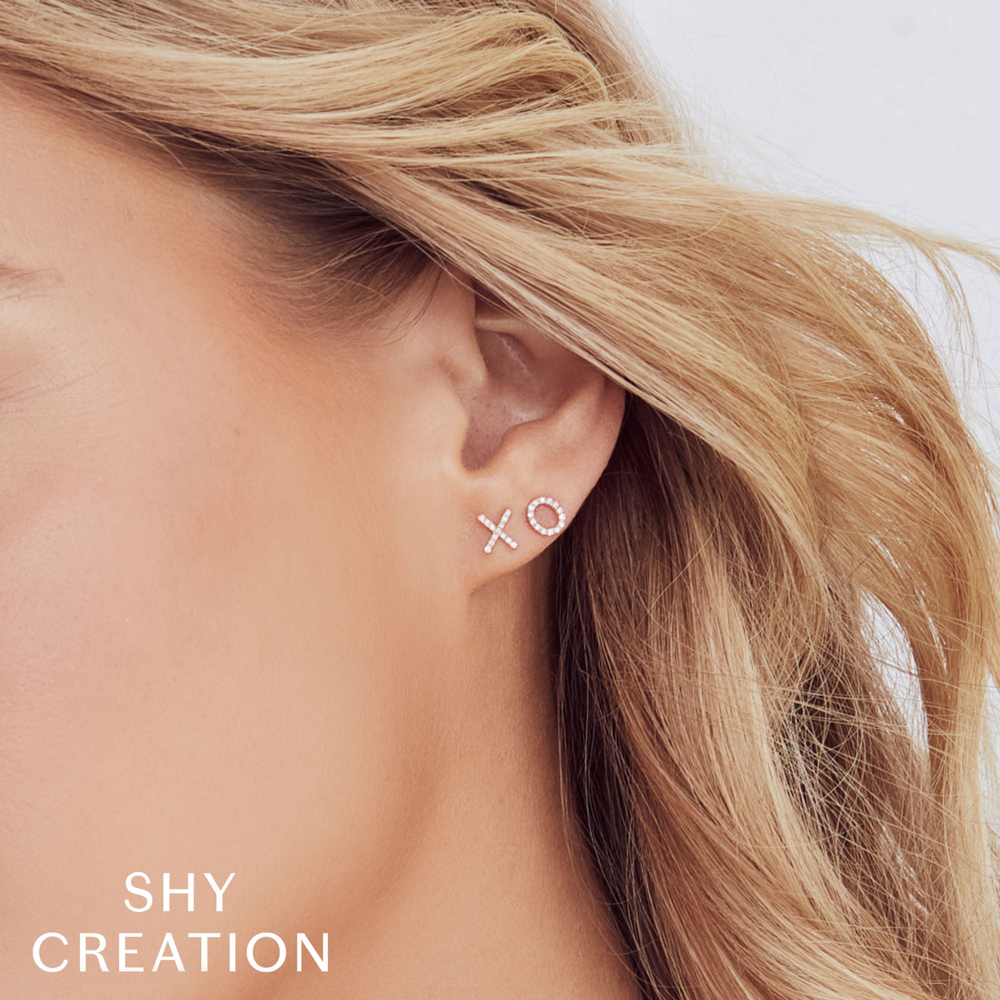 0.09CT 14K Y/G DIAMOND ""XO"" STUD EARRING