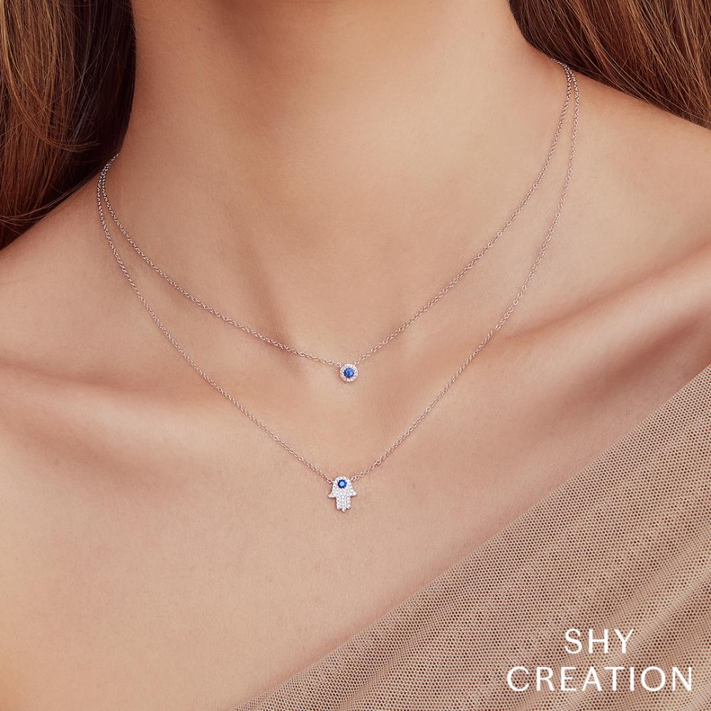 0.09CT DIAMOND & 0.08CT BLUE SAPPHIRE 14K Y/G HAMSA NECKLACE