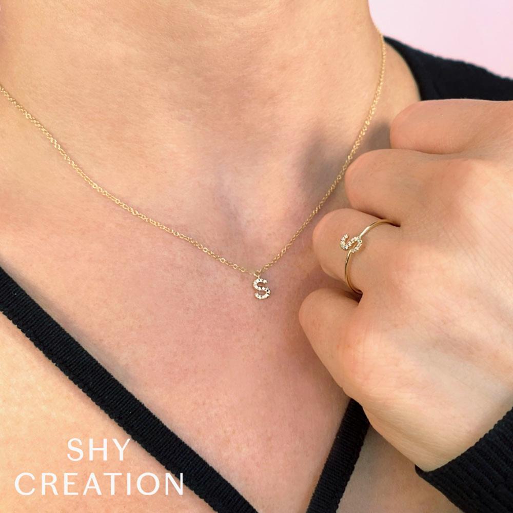 0.04CT 14K Y/G DIAMOND LADYS RING - INITIAL Q