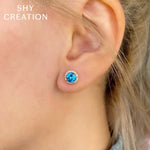 0.14CT DIAMOND & 2.06CT BLUE TOPAZ 14K W/G STUD EARRING