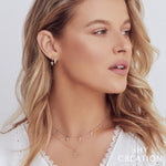 0.11CT 14K Y/G DIAMOND HUGGIE EARRING