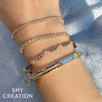 0.64CT 14K Y/G DIAMOND BEZEL TENNIS BRACELET