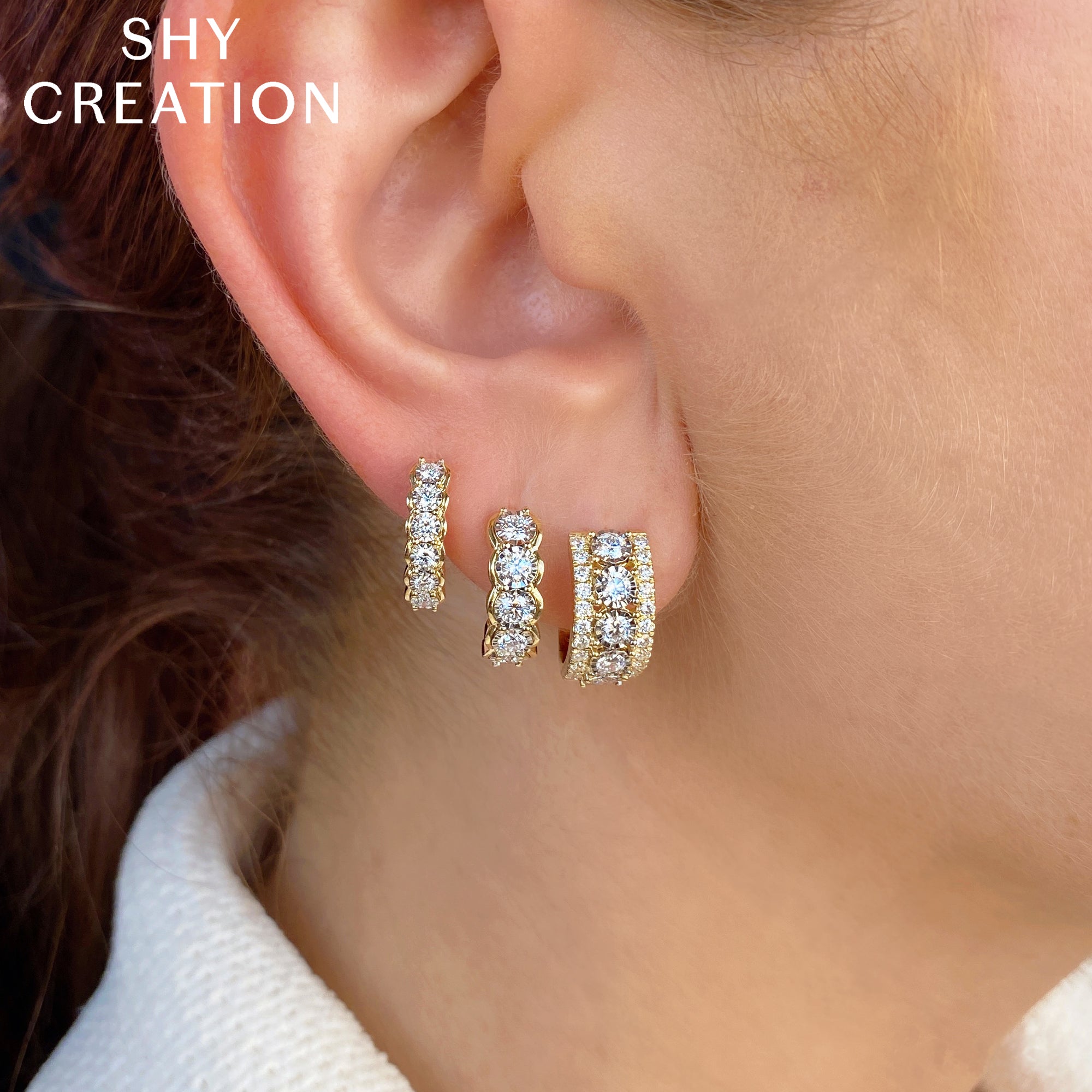 0.23CT 14K Y/G DIAMOND HUGGIE EARRING