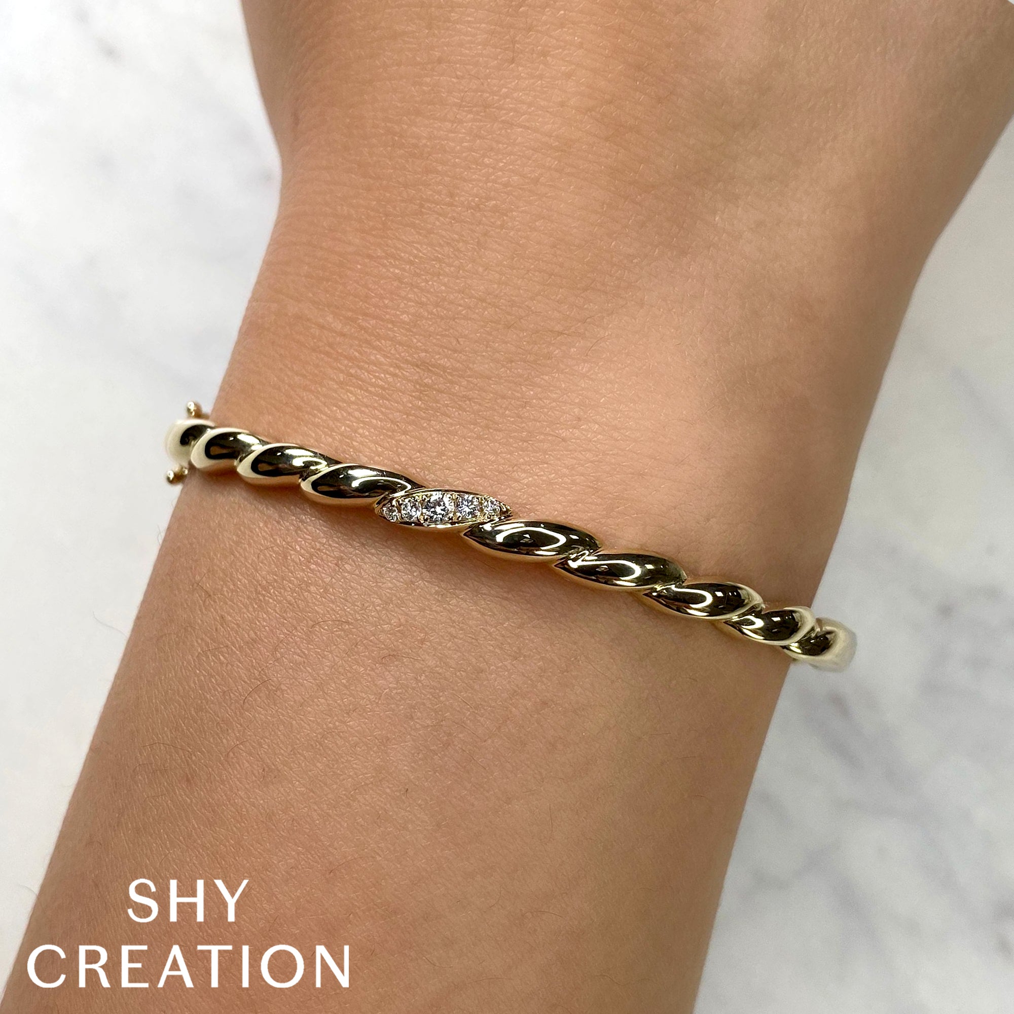 0.13CT 14K Y/G DIAMOND TWISTED BANGLE