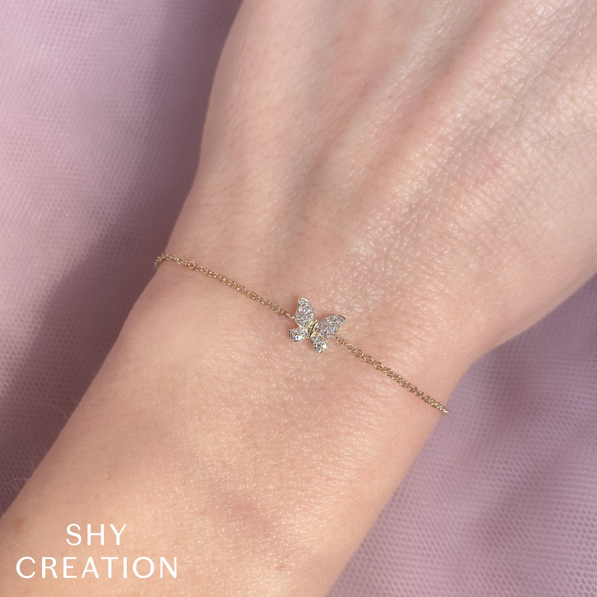 0.08CT 14K W/G DIAMOND BUTTERFLY BRACELET