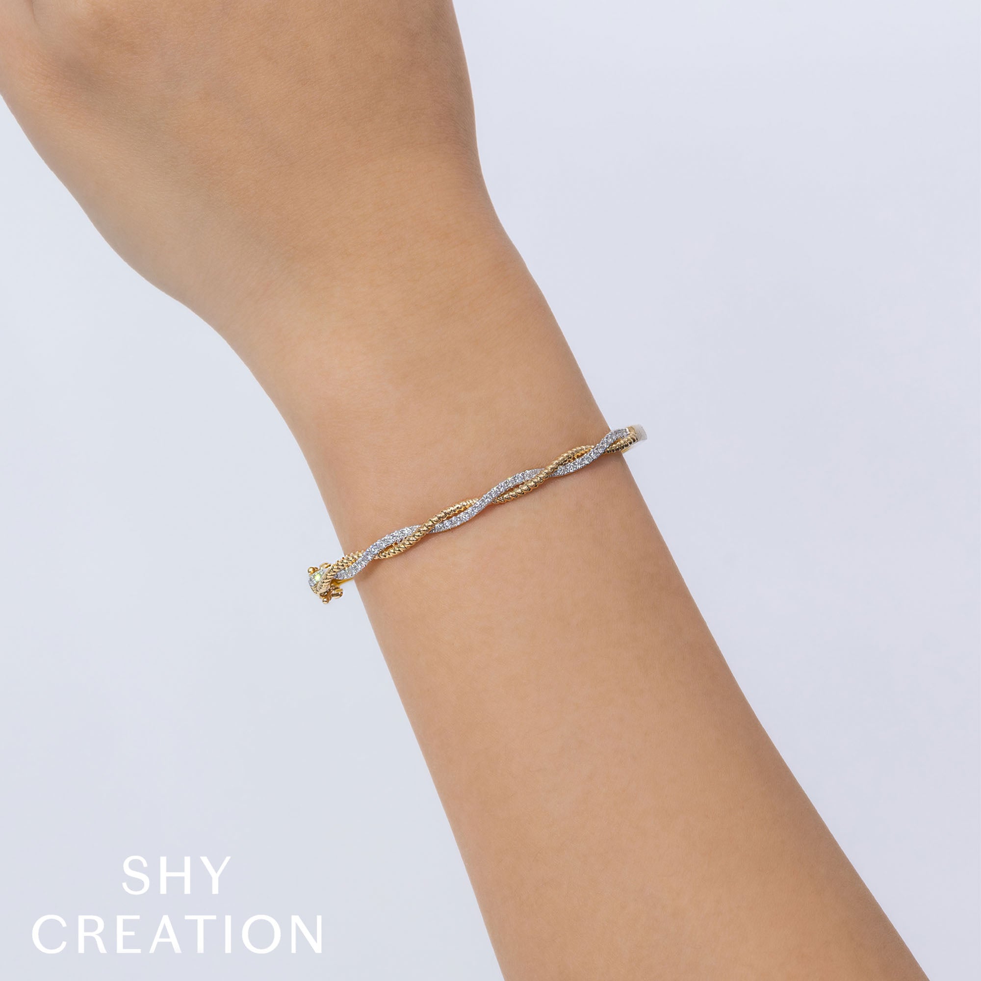0.53CT 14K Y/G DIAMOND TWISTED BANGLE