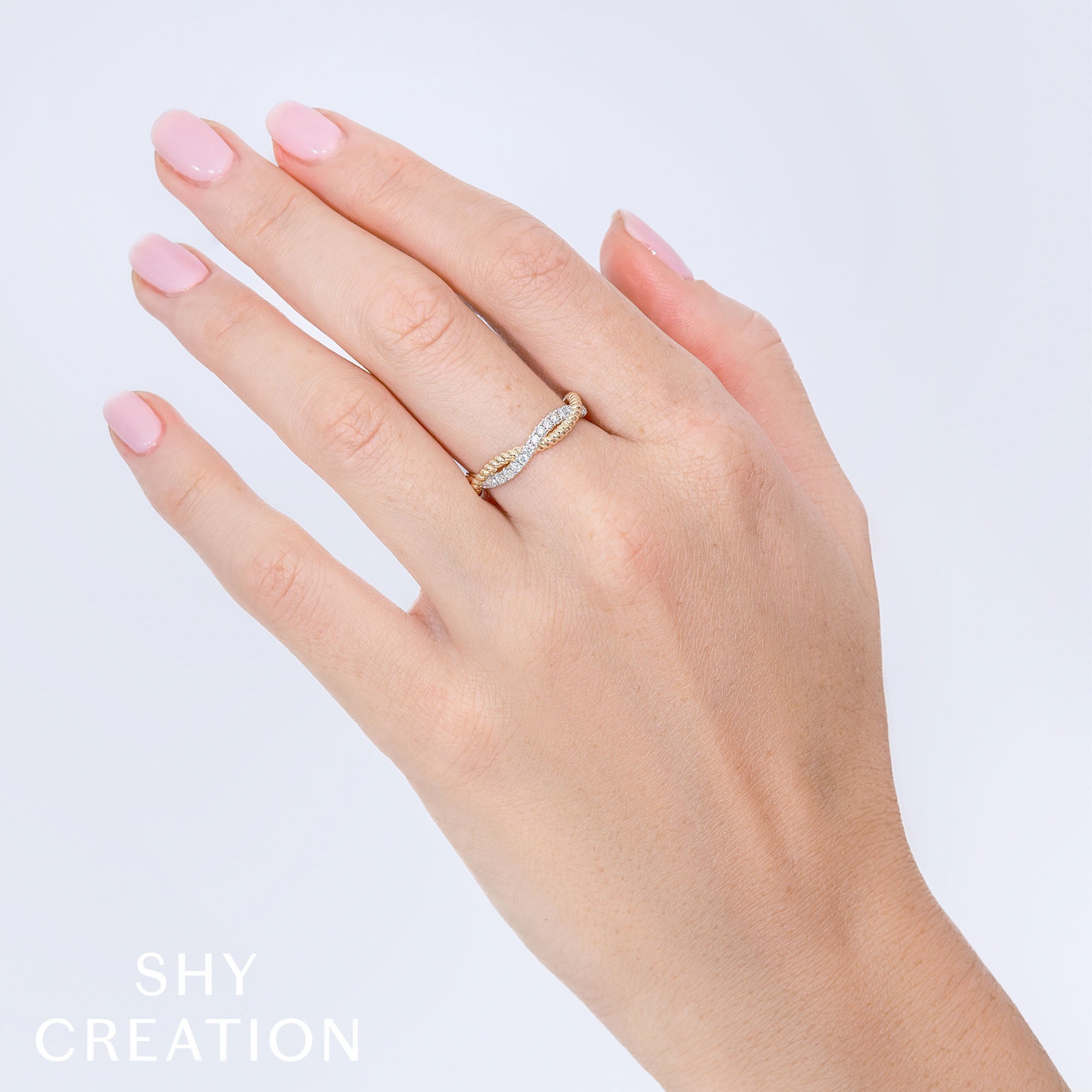 0.22CT 14K Y/G DIAMOND TWISTED RING