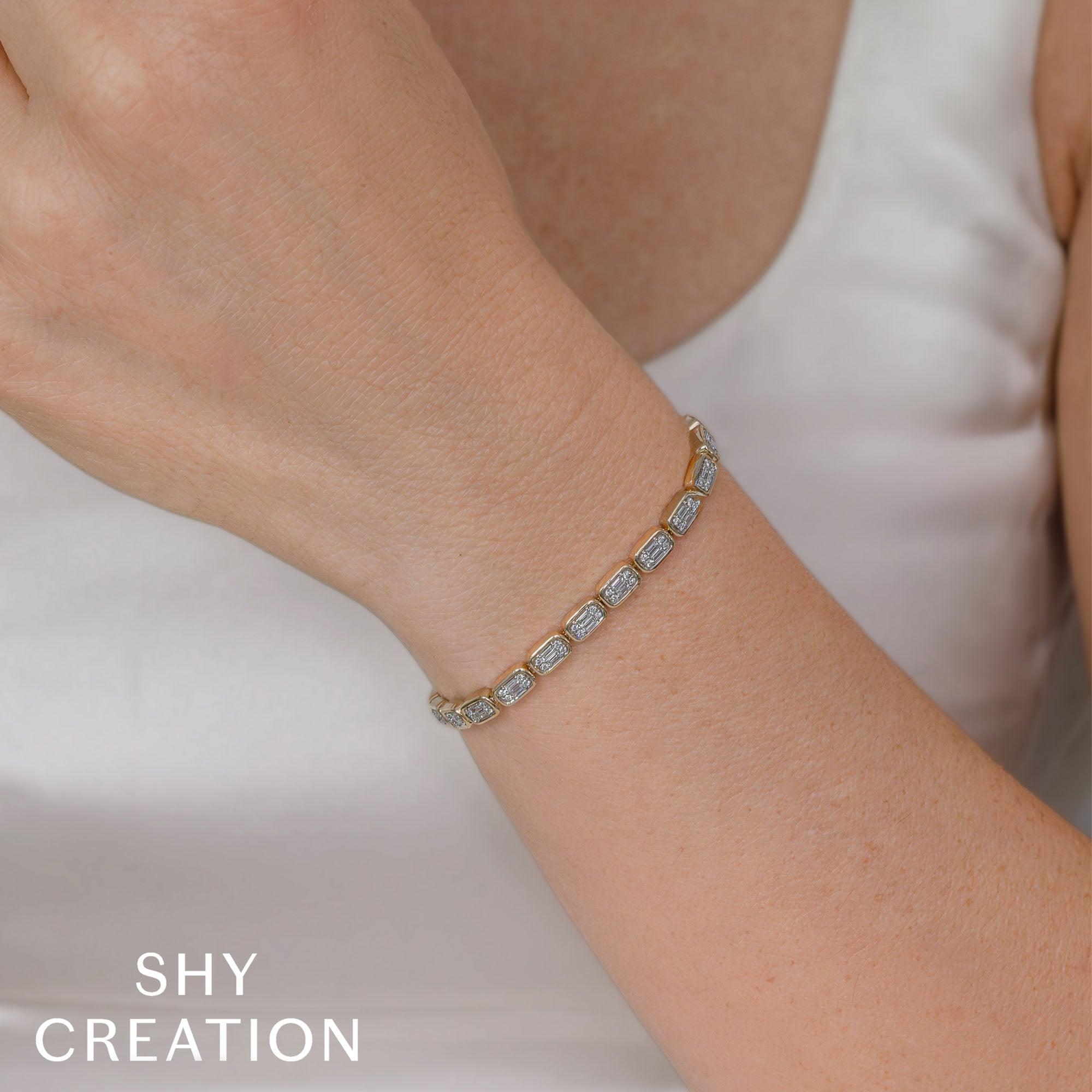 1.53CT 14K W/G DIAMOND BAGUETTE TENNIS BRACELET