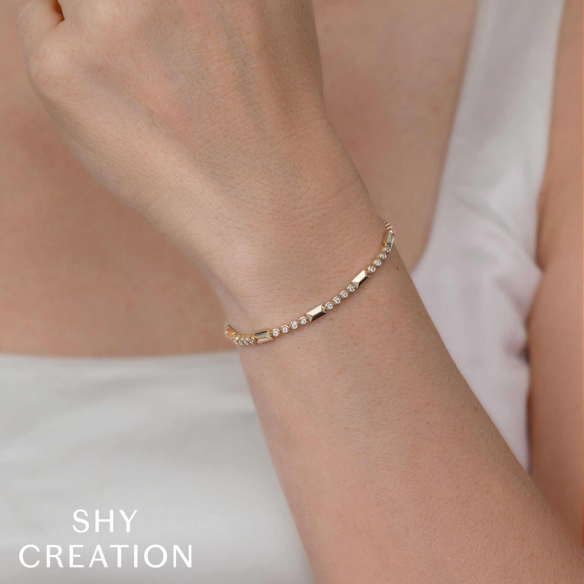 0.54CT 14K Y/G DIAMOND BEZEL GEO CUT BRACELET
