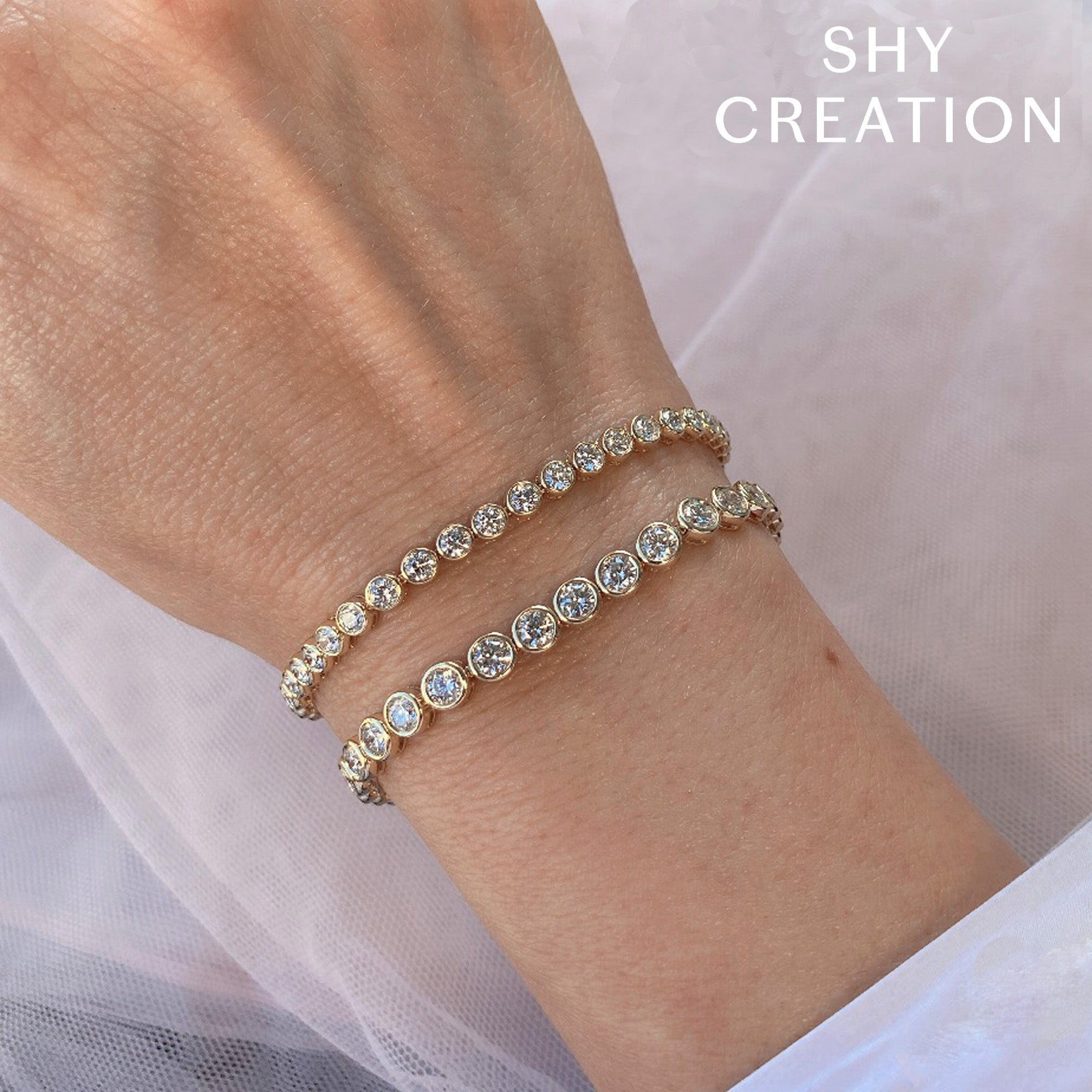 7.00CT 14K Y/G DIAMOND BEZEL TENNIS BRACELET